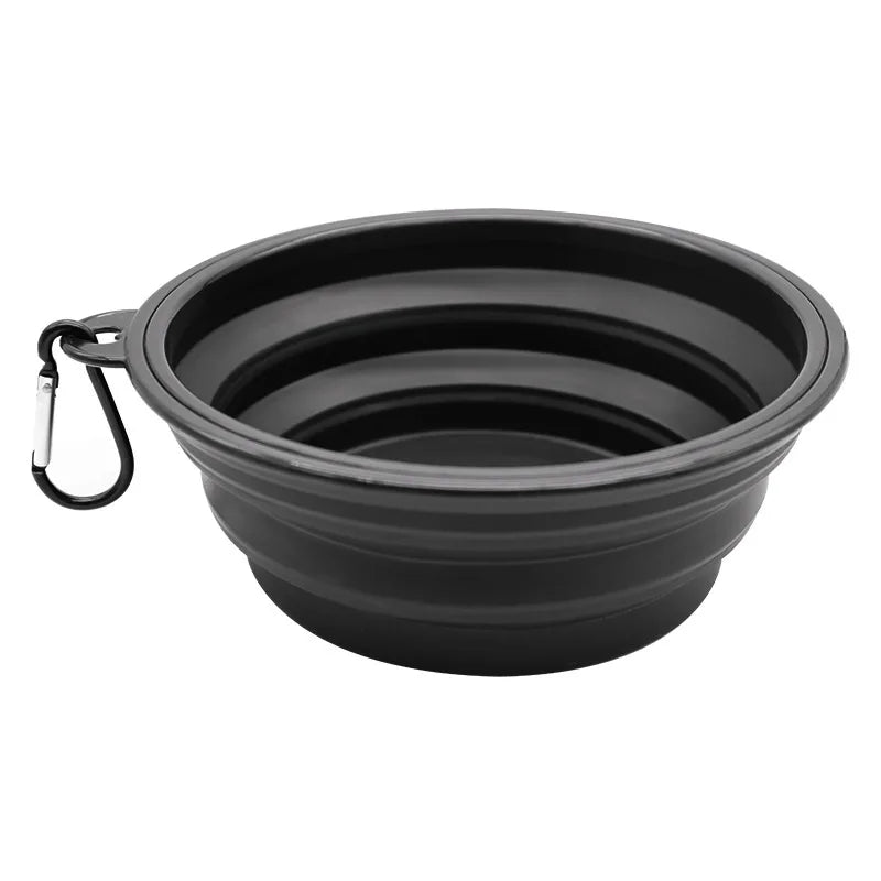 Portable silicone dog feeder bowl with carabiner, food and water dispenser for outdoor travel, suitable for dogs and cats.