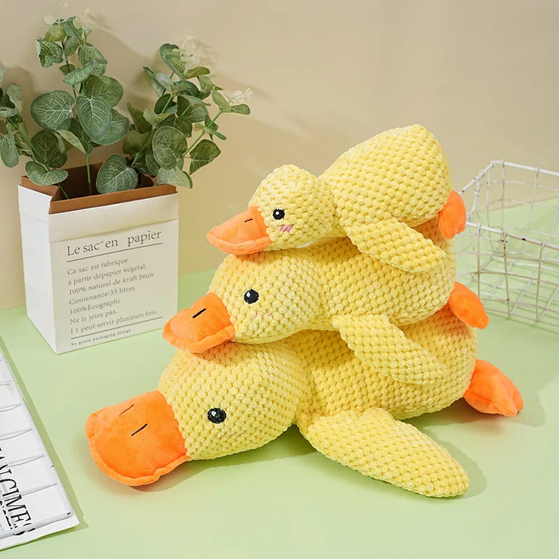 Soft plush duck hugging toy from A minha loja, featuring a cute yellow duck with flappy wings and a gentle smile.