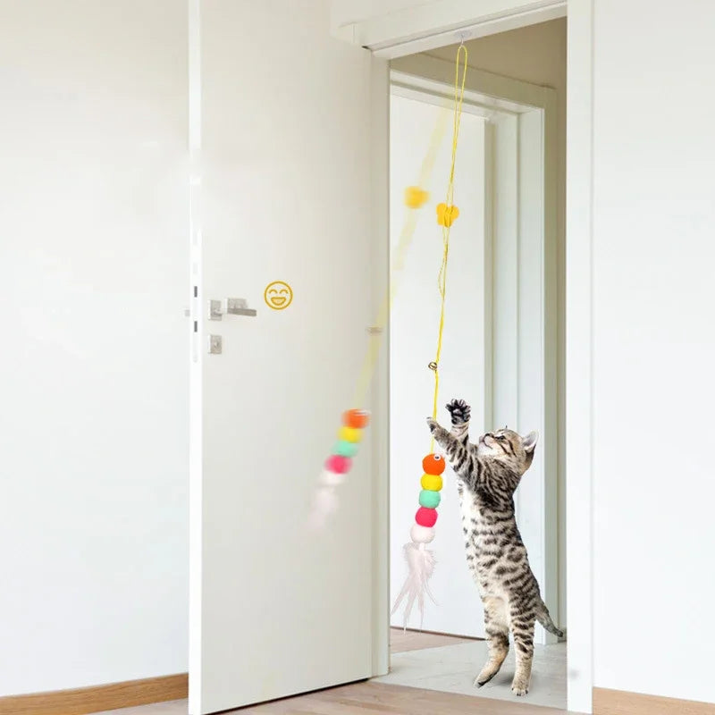 Interactive cat toy by A minha loja featuring a hanging feather stick with retractable wand and suction cup for engaging play.