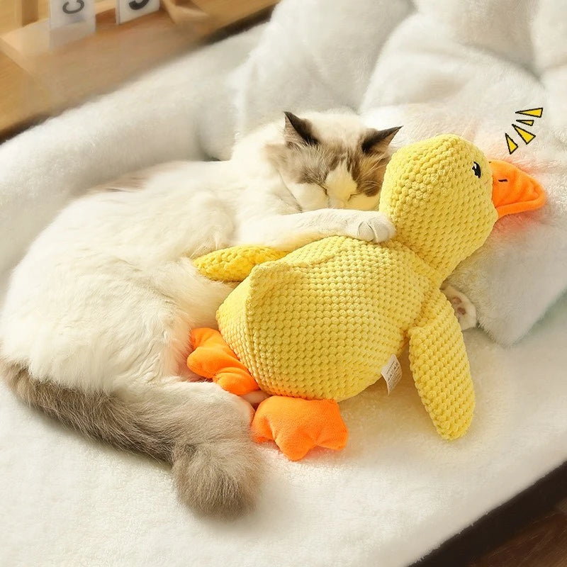 Soft plush duck hugging toy from A minha loja, featuring a cute yellow duck with embroidered eyes and a gentle expression.